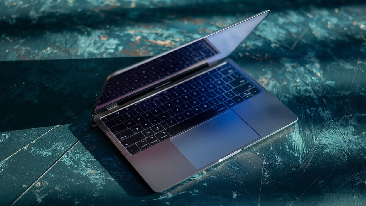 Obraz przedstawia cyfrową makietę laptopa wyświetlaną w eleganckim nowoczesnym stylu