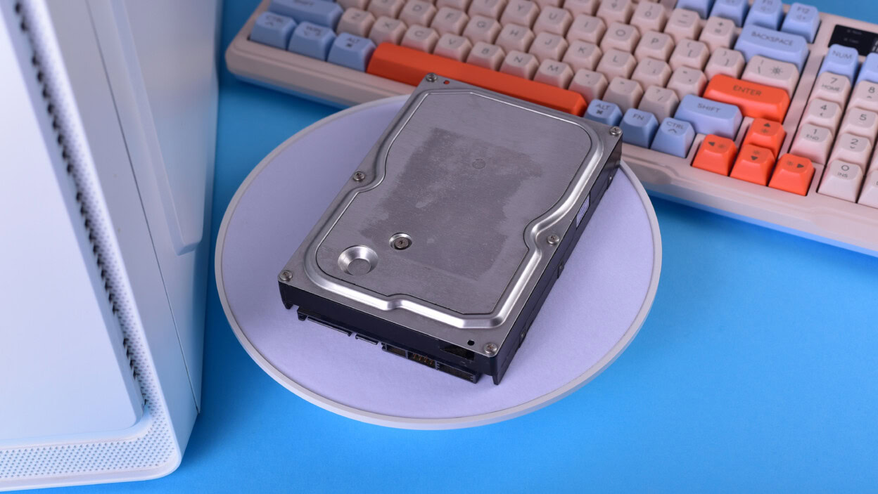 Minimalist tech setup with old hard disk