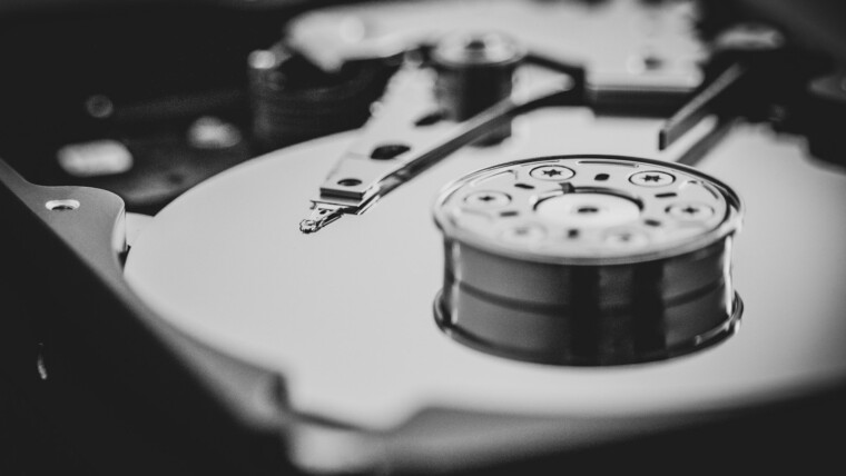 white and black turntable in grayscale photography